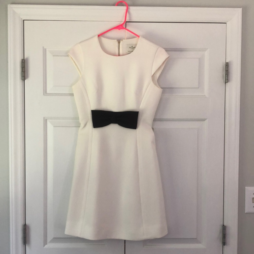 Kate Spade cream dress with a black bow. Size 0